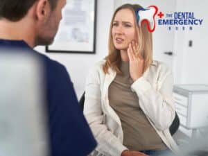 Woman consulting a dentist about jaw pain caused by Teeth Grinding