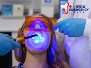 Teeth whitening procedure with blue light activation at a dental clinic